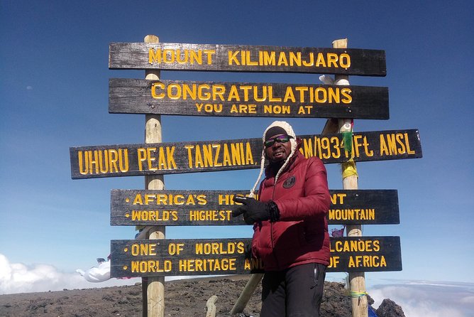 5 Days Marangu route Climbing Mt. Kilimanjaro - Day four: midnight-to-dawn summit push, headlamp time, and the Uhuru Peak win