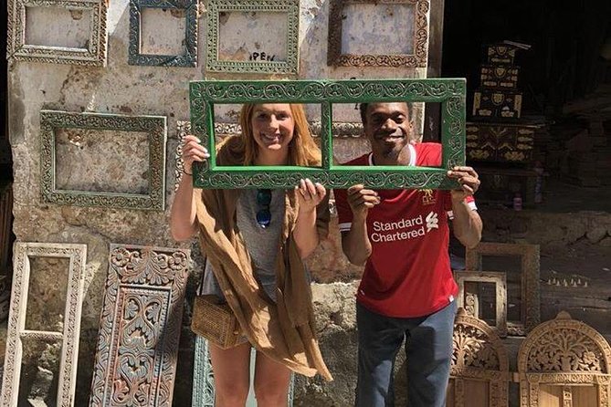 Cultural Walking Tour through Stonetown, a UNESCO World Heritage Site - Jaws Corner: coffee, Bao Game, and people-watching