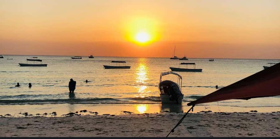 FROM NUNGWI; SUNSET DHOW CRUISE EXPERIENCE - Snacks, tropical fruits, and the onboard music moment