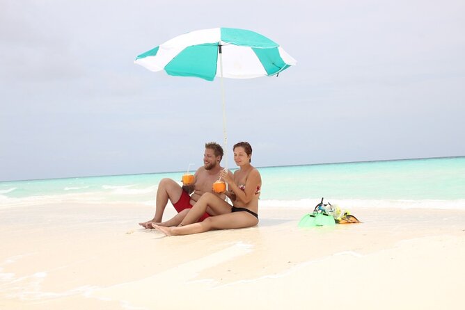 Full-Day Blue Lagoon and Sandbank Boat Tour from Zanzibar ( Safari blue) - Stop 1, Kwale Island: The Fallen Baobab and a Beach You Can Explore