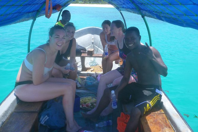 Half Day Zanzibar Mnemba Atoll Marine Reserve Snorkeling Tour - On board: fruits, water, snacks, and the lunch gap