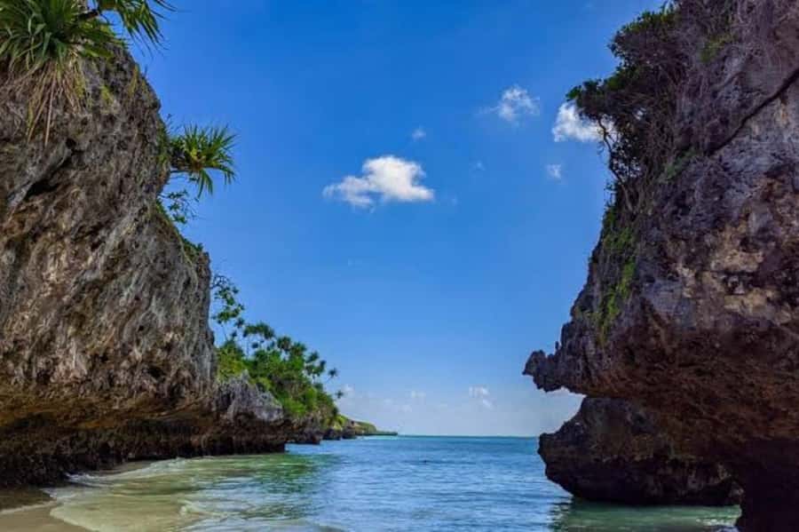 Kuza Cave, Hidden Mtende Beach & The Rock Restaurant - Kuza Cave: limestone gardens, a natural pool, and a swim you can actually do