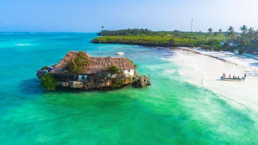 Salaam Cave Tour, Lunch at The Rock, Mnemba Dolphin Tour - Paje Village beach time in Zanzibar’s white-sand strip