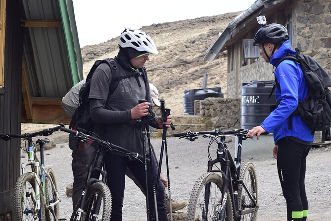 Top 6 Days Mt. Kilimanjaro Bike trek Tour by Marangu-Kilema Route - Day 5: Summit night at 4:00 am, zigzags, Hans Meyer’s Cave, and riding into Uhuru