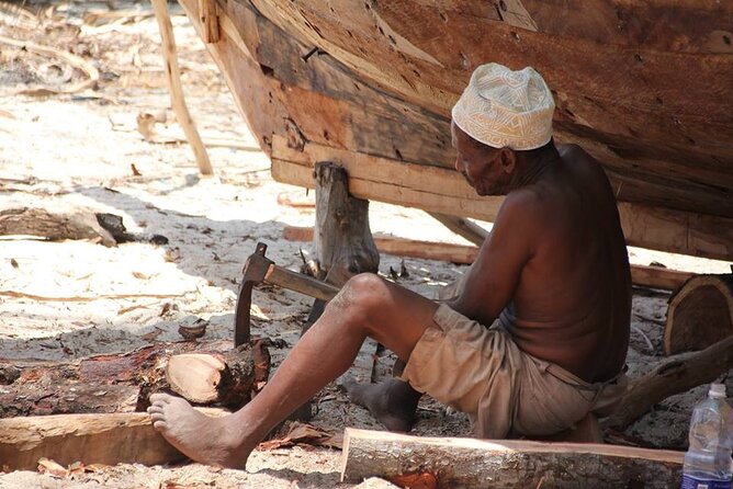 Zanzibar Full Day Mnemba Island, Nungwi and Kendwa Beach Tour - Nungwi Fishing Village: Fish Market Energy and Dhow Construction Details